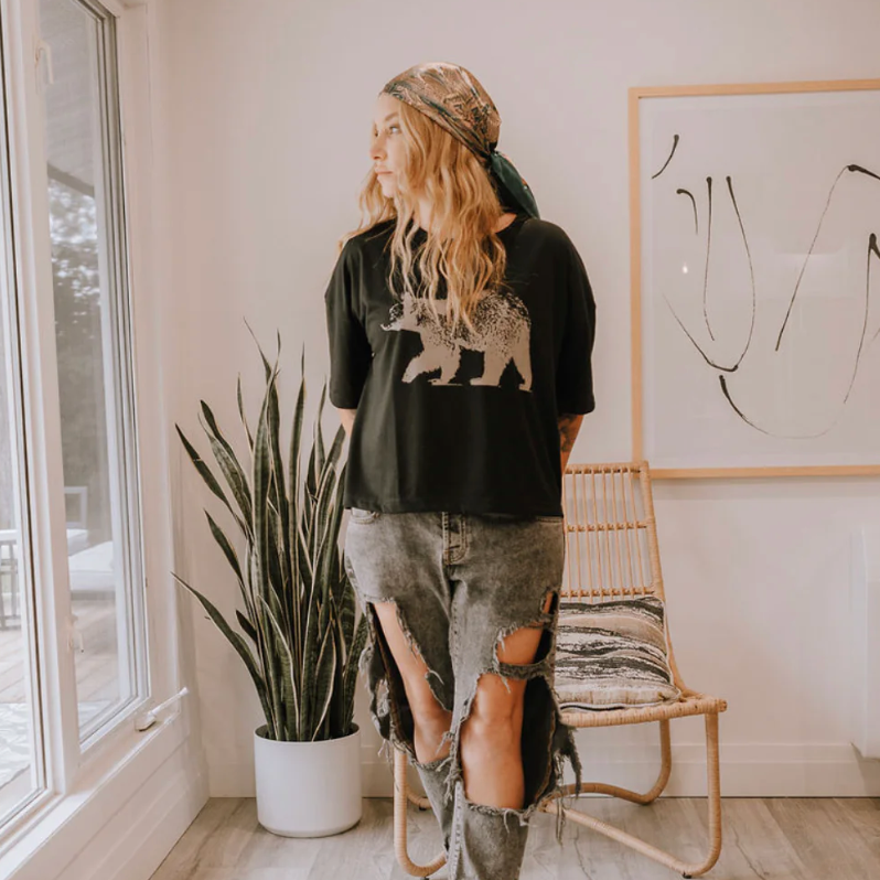 Woman in bear shirt and ripped jeans, Sept 11 screenshot.