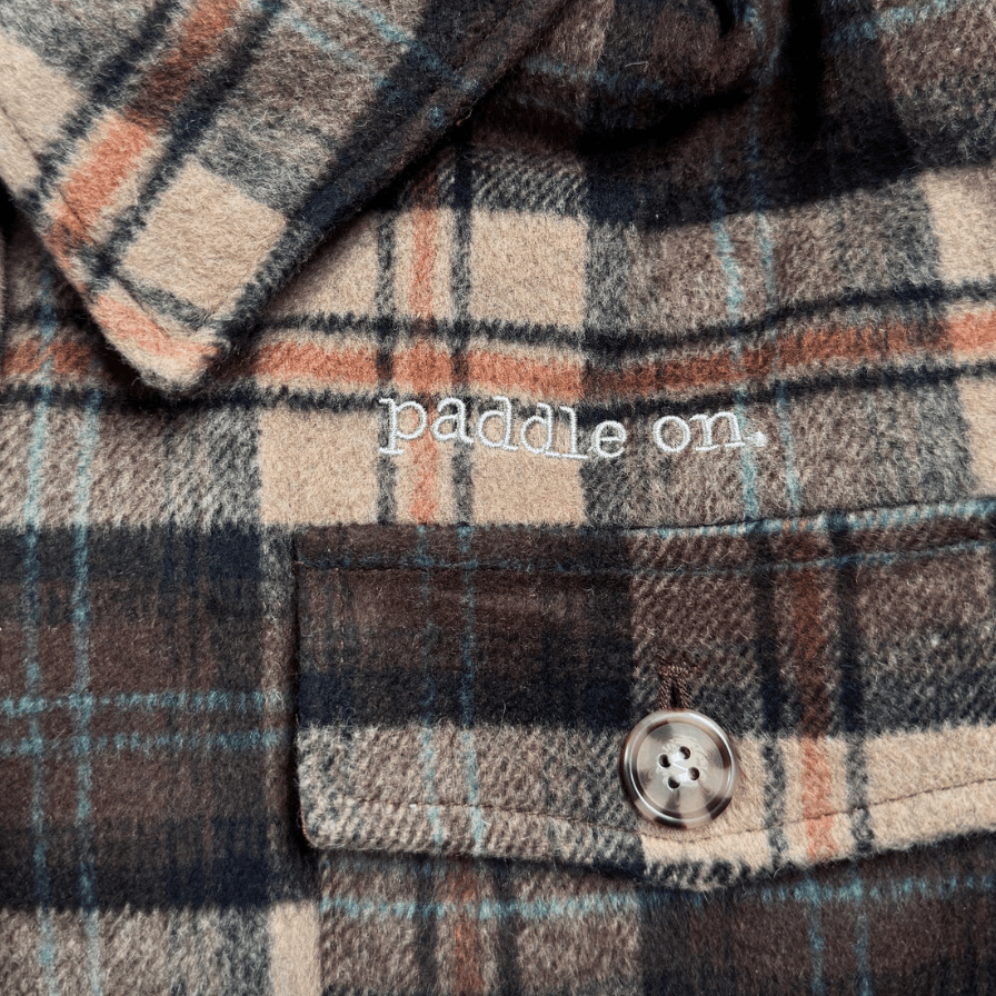 Plaid shirt with paddle on embroidery, screenshot from 2025.