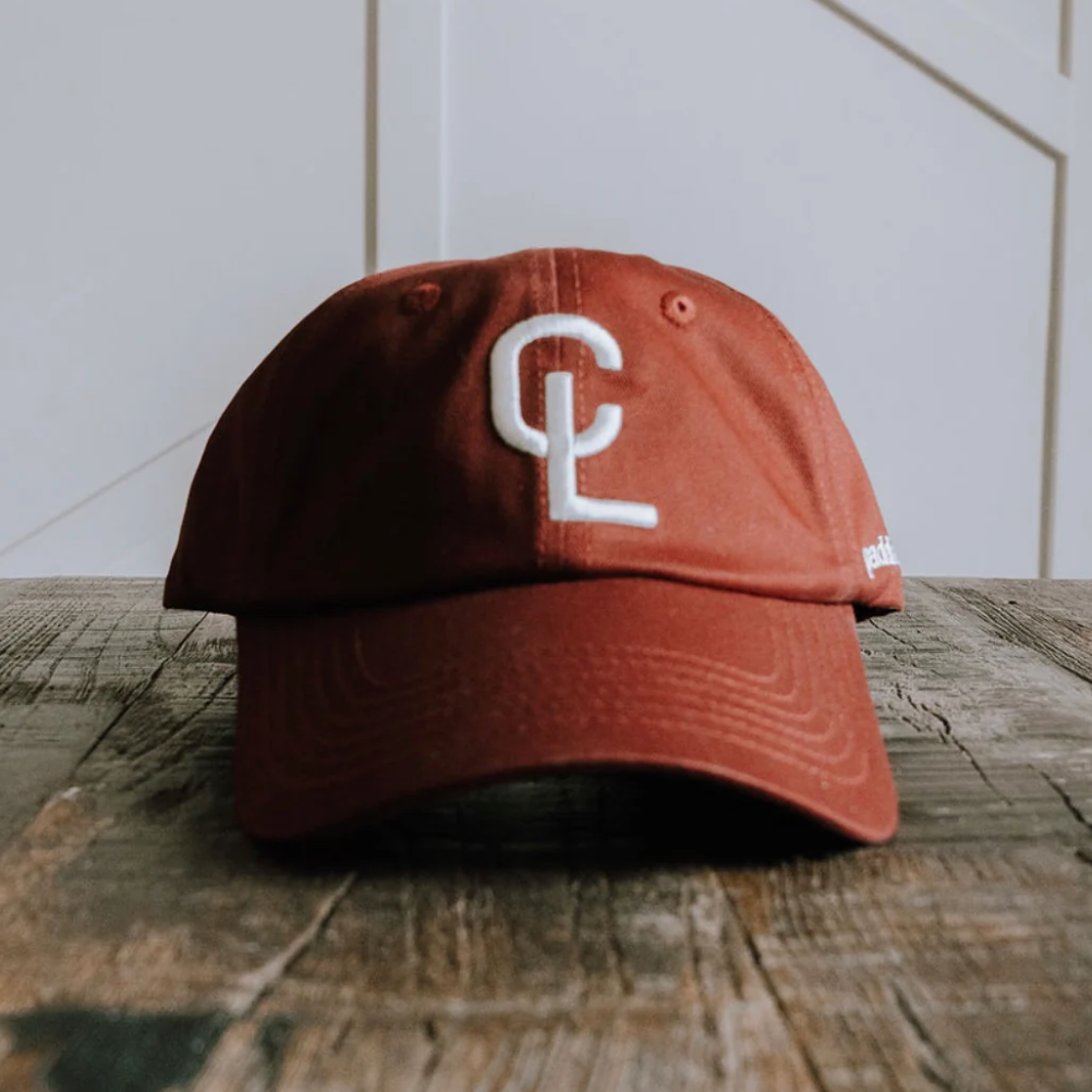 Red baseball cap with CL logo, screenshot from Sept 12, 2025.