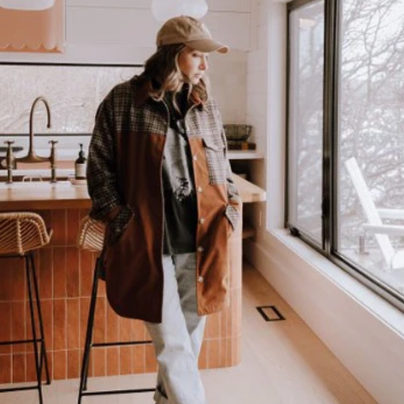 Woman in jacket by window, screenshot from Sept 12, 2025.