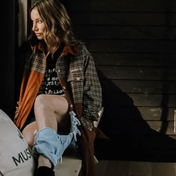 Woman in plaid jacket, screenshot from Sept 12, 2025