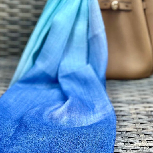 Blue ombre scarf and tan handbag, Sept 15 screenshot.