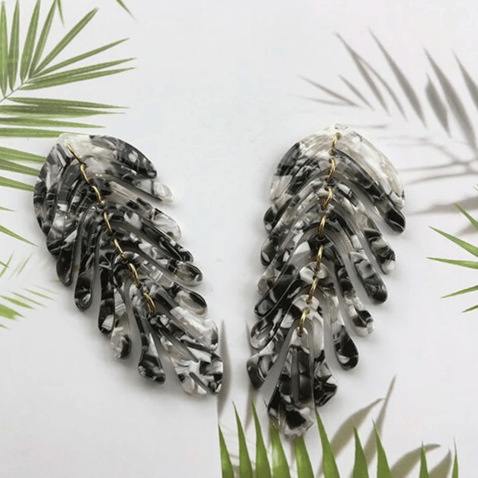 Black and white leaf earrings, screenshot from 2025