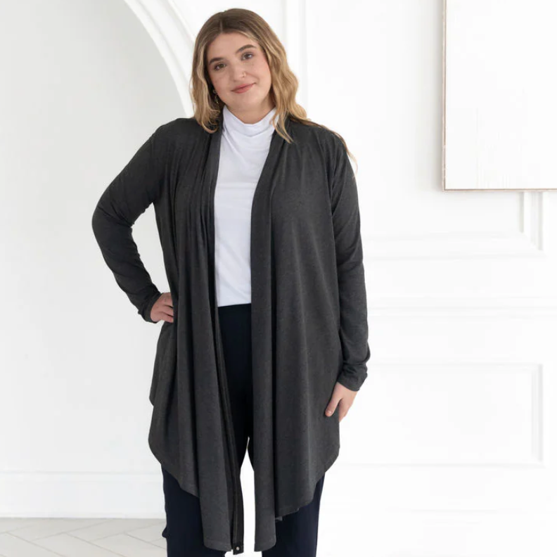 Woman in dark gray cardigan, Screenshot 2025-09-16.