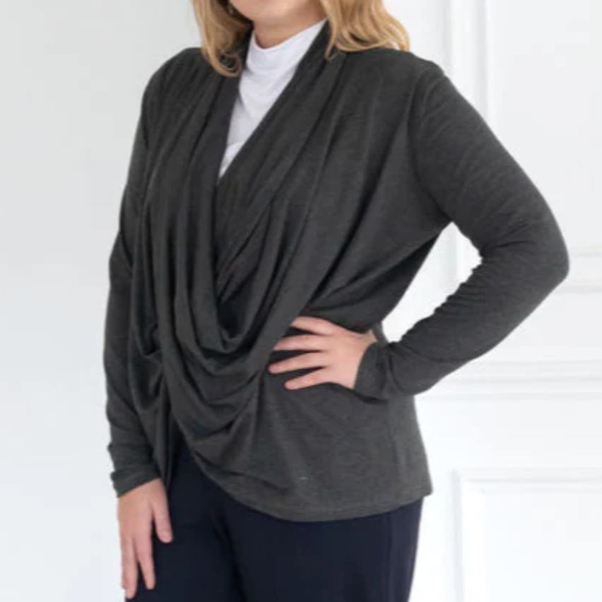 Woman wearing a draped gray top, screenshot from Sept 16, 2025.