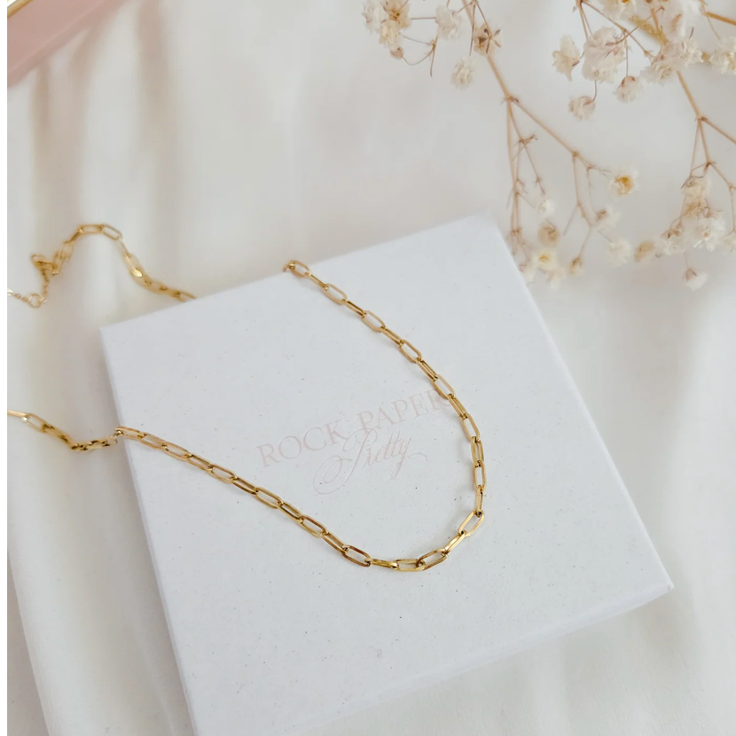 Gold chain necklace on white box, screenshot from Sept 1, 2025.