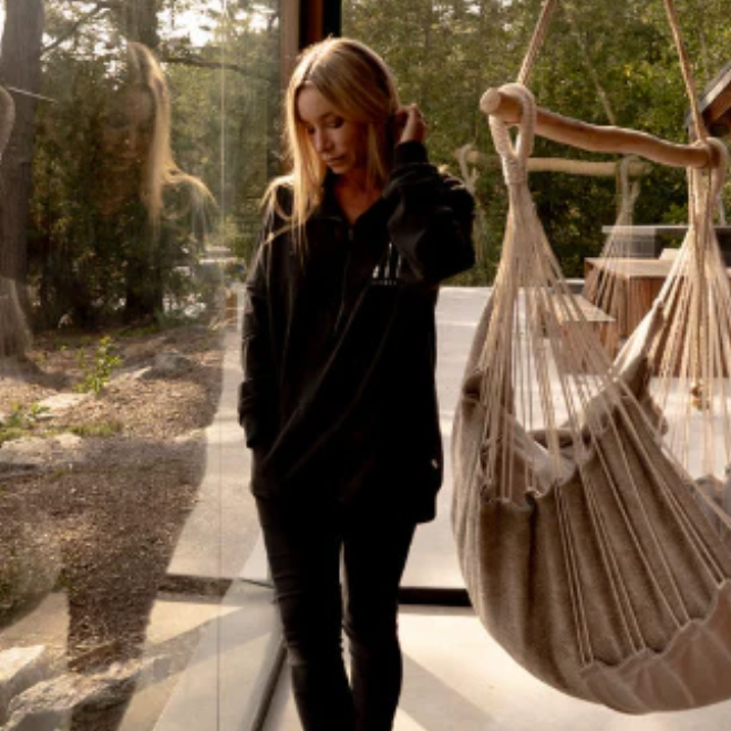 Woman in black clothing near hammock, Sept 18, 2025 screenshot