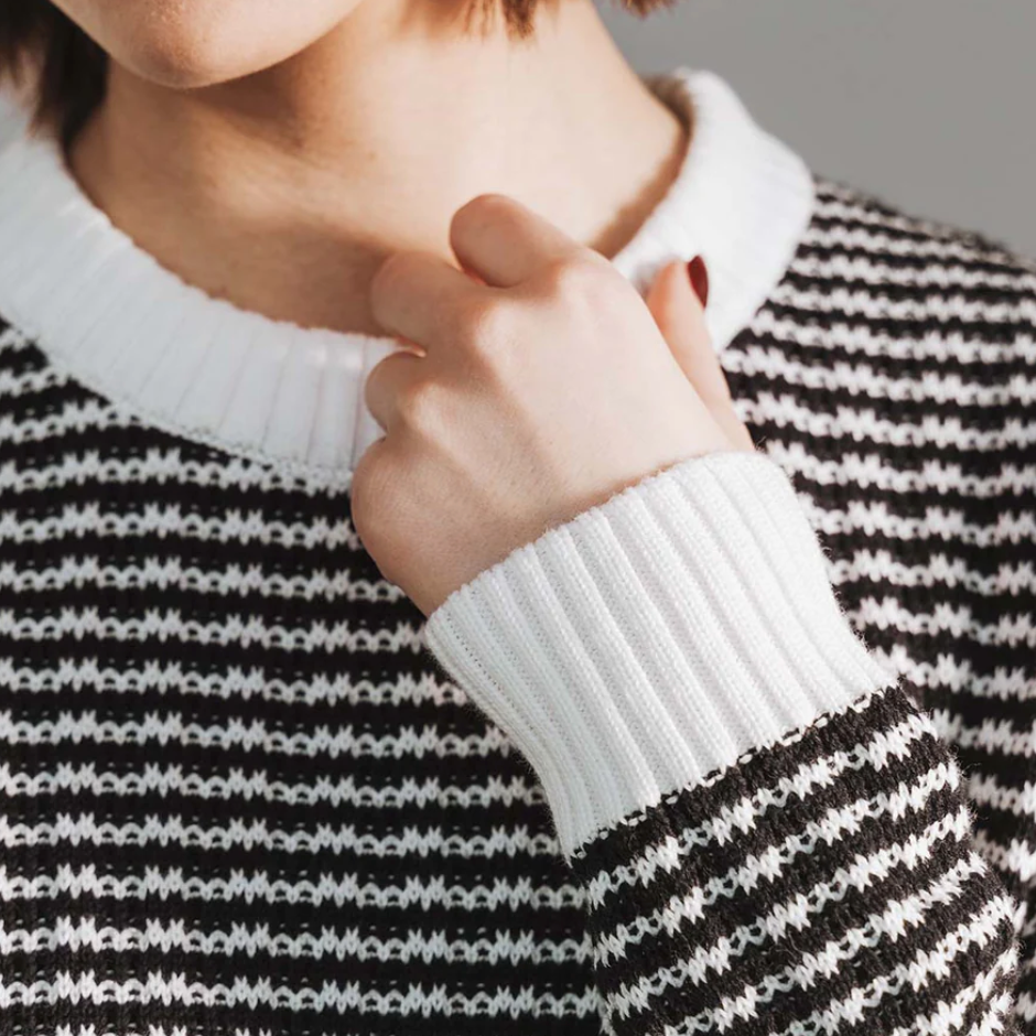 Woman in striped sweater, screenshot 2025-09-20 at 9.57 PM