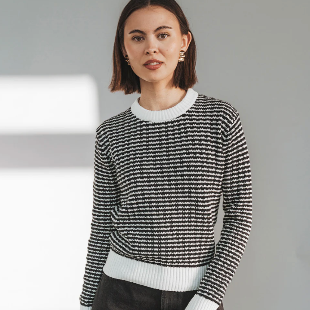 Woman in striped sweater, Screenshot Sept 20, 2025